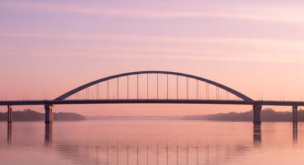 Obraz premium Serene arch bridge gracefully spans tranquil waters under a soft, pastel dawn sky, evoking peace and connection