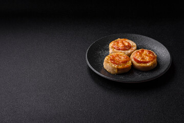 Round fish or chicken cutlets baked with tomato and cheese. Fish cutlets