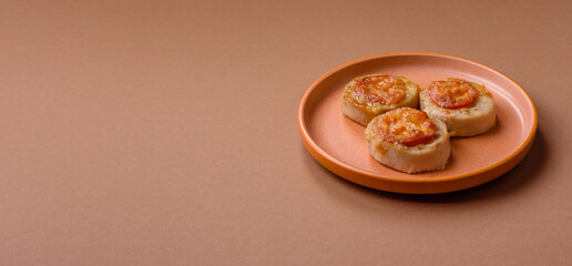 Round fish or chicken cutlets baked with tomato and cheese. Fish cutlets