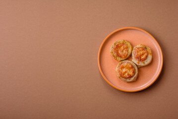Round fish or chicken cutlets baked with tomato and cheese. Fish cutlets