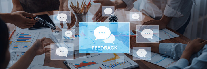 A diverse business team engages in feedback discussion, showcasing charts and graphs. Communication is central to strategy and productivity in a modern workspace. Trope