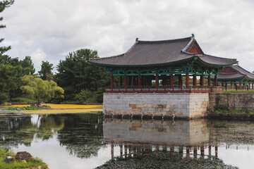 Naklejka premium Gyeongju, South Korea, view of Donggung Palace and Wolji Pond in a sunny day, North Gyeongsang Province, Gyeongju city, Silla dinasty traditional Korean hanok architecture, Yeongnam region