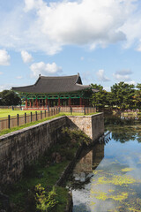 Fototapeta premium Gyeongju, South Korea, view of Donggung Palace and Wolji Pond in a sunny day, North Gyeongsang Province, Gyeongju city, Silla dinasty traditional Korean hanok architecture, Yeongnam region