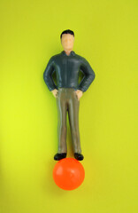 Confident executive balancing on a sphere