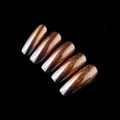 Five glossy, almond-shaped press-on nails with shimmering gold glitter stripes on a dark background — elegant, chic, and ready for glam.