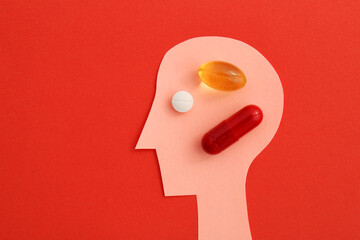 Person taking several types of medication, head silhouette