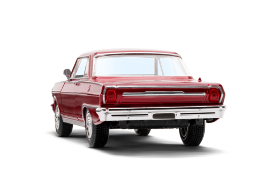 Rear and partial left side view of a red colored musscle model toy car photographed on a transparent background.