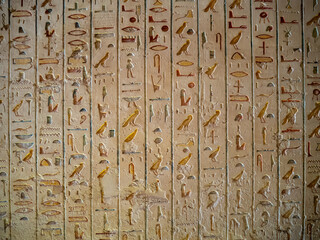 VALLEY OF THE KINGS, EGYPT : Interior of a tomb in the Valley of the Kings, featuring intricate wall paintings and hieroglyphs that tell stories of ancient Egyptian pharaohs.