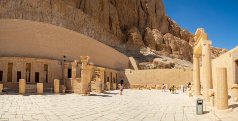 LUXOR, EGYPT : The Mortuary Temple of Hatshepsut at Valley of the Queens, an impressive ancient Egyptian monument built into limestone cliffs, visited by travelers from around the world.