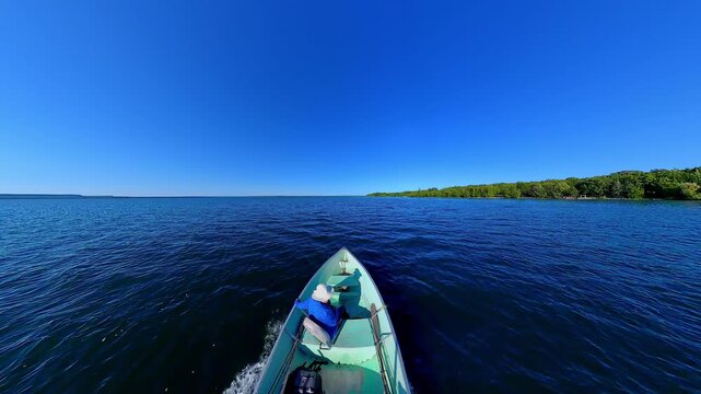 Fishermen on vacation, boating in lake Manitou, Manitoulin Island, Ontario, Canada. End of fishing game tournament. Water sport at fall. Power sport fishing and watersport.