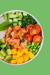Poke bowl with salmon, avocado, mango and vegetables

Japanese sushi bowl with salmon cubes and fresh ingredients

Colorful poke bowl with salmon and vegetables

