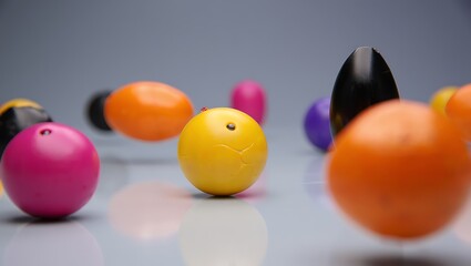 Colorful round objects on reflective surface abstract composition studio shot