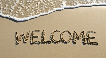 Fototapeta premium Welcome text written on sandy beach with sea wave