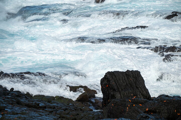 waves crashing on rocks