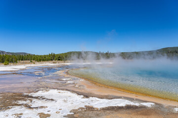 Black Sand Basin is one of a grouping of geothermal hot springs and geysers. Upper Geyser Basin, Yellowstone National Park, Wyoming. Hydrothermal System. hot-spring deposits. Extremophile. 
