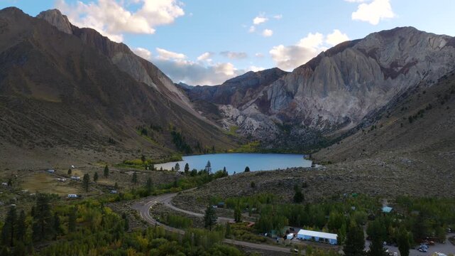 Mammoth Lakes California - Low Aerial Approach Towards Convict Lake at Sunset with Car Passing By