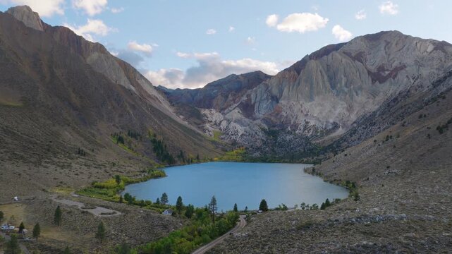 Mammoth Lakes California - Aerial Approach Towards Convict Lake at Sunset with Car Driving Below 