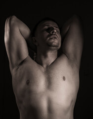 Cropped shot of an unrecognizable and athletic young man posing shirtless. Man body. Sensual. Background. Sport. Diet. 