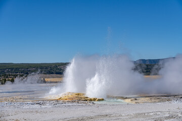 Clepsydra Geyser. Fountain Paint Pot Trail. Lower Geyser Basin in Yellowstone National Park. Hydrothermal System. hot-spring deposits. Extremophile. 
