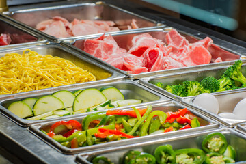 Magnolia grill, Asian buffet food in trays