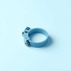A light blue metal clamp with bolts and nuts, isolated on a light blue background.