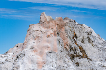 Fototapeta premium White Dome Geyser, Firehole Lake Drive. Lower Geyser Basin. Yellowstone National Park, Wyoming. hot-spring deposits. Extremophile. 