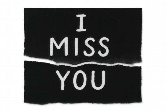 Torn black paper displaying i miss you message, symbolizing longing, separation, distance, and heartbreak