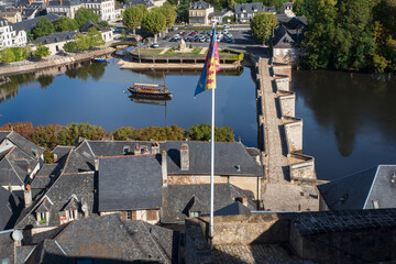 View of the town of Terrasson in the Dordogne region of France, with its typical rooftops, river and bridges