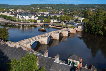 View of the town of Terrasson in the Dordogne region of France, with its typical rooftops, river and bridges