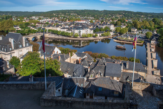 View of the town of Terrasson in the Dordogne region of France, with its typical rooftops, river and bridges