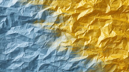 Gold and blue abstract background featuring crumpled paper painted in metallic gold and deep blue tones. Textured surface with artistic folds and creases for design projects