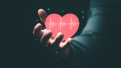 Portable medical technology with heart monitoring, a health-conscious man showing a heart symbol, and an electrocardiogram concept
