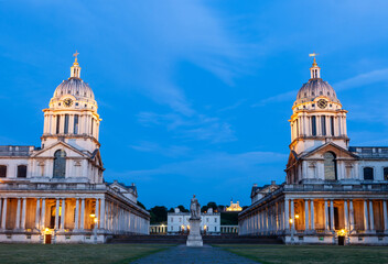 Iconic domes of the Old Royal Naval College in Greenwich, London, illuminated at dusk. © Eugene Ga