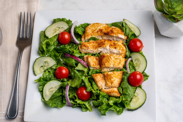salad top with sliced chicken breast