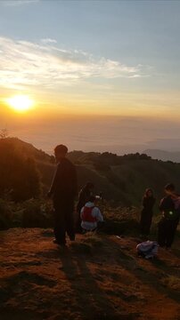 central java, indonesia - october 7, 2025 : Scenic hiking activity on Mount Prau, located in Dieng, Central Java, Indonesia. Stunning natural landscape with mountain views