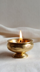Ornate Brass Oil Lamp with Flickering Flame for Religious Ceremonies and Spiritual Worship