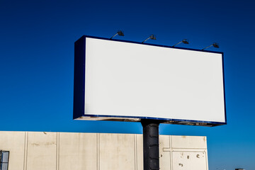 Blank billboard against a clear blue sky in Brazil. Ideal for advertising mockups, marketing materials, and urban landscape illustrations.