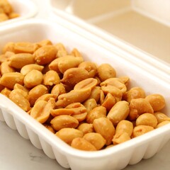 Roasted peanuts in a styrofoam container