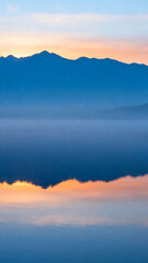 Mountain lake sunrise reflection