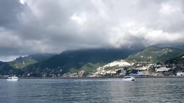 scenic amalfi coast with boats and mountain landsc
