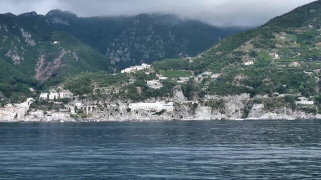 scenic amalfi coast with boats and mountain landsc