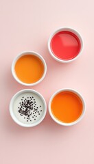 Overhead Shot Featuring Colorful Liquids in Small Bowls with a Pink Background for a Clean and Minimal Composition