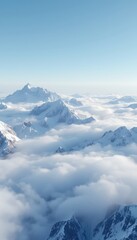 Fototapeta premium A serene vista of snow-capped mountain peaks piercing through a sea of soft, undulating clouds under a vast, pale sky