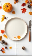 Festive Thanksgiving dining table setup with autumn leaves, a decorative pumpkin, and an elegant plate setting on a clean white background