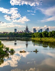 Fototapeta premium Cityscape with river, trees and skyline under a cloudy sky