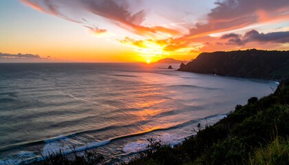 Golden Sunset Over Ocean and Rocky Coastline