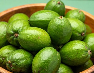 Green Avocados Stacked in Bowl