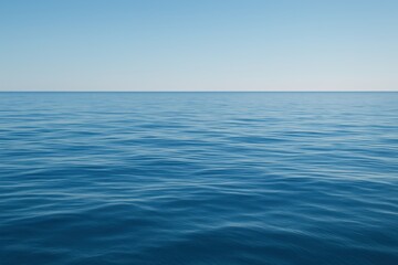 Obraz premium Tranquil rippling blue ocean surface with gentle light reflections and open horizon