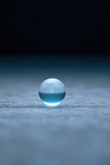 Glass orb bouncing and floating slightly, Gravity on the Moon