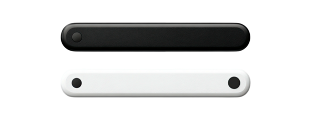Two sleek, rectangular, rounded-end objects; one black, one white, with a circular design element each